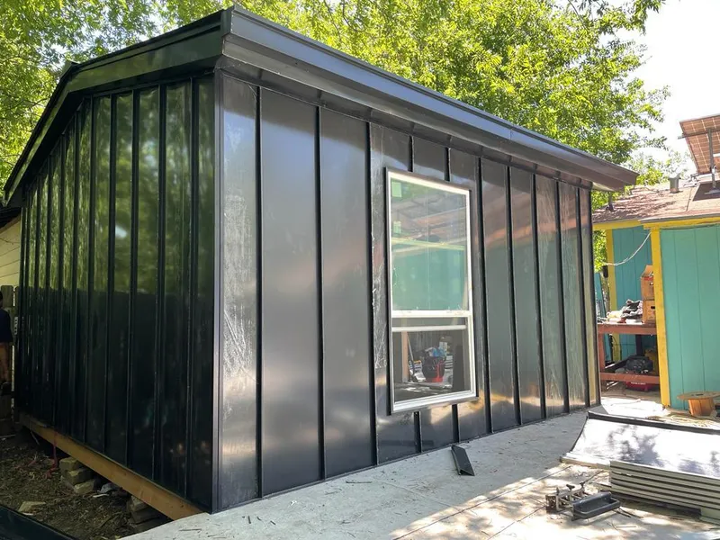 Black standing seam metal wall panels for Roof Inspection in Jamul