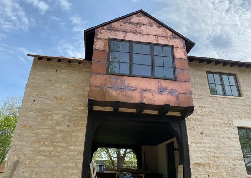 Copper metal panel facade on a stone building for Roof Repair in Jamul