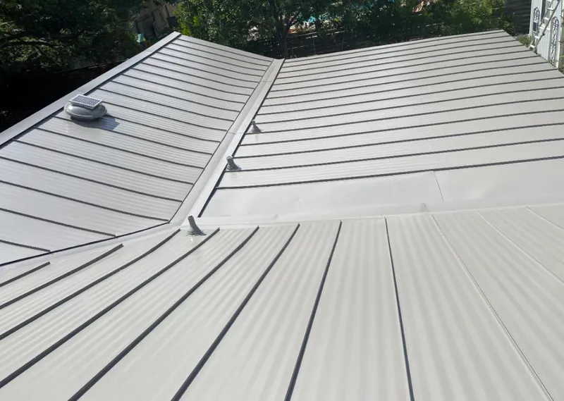 Solar attic fan installed on a metal roof for Roof Ventilation in Jamul